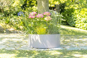 Pot décoratif Rodéo coloris taupe en aménagement extérieur